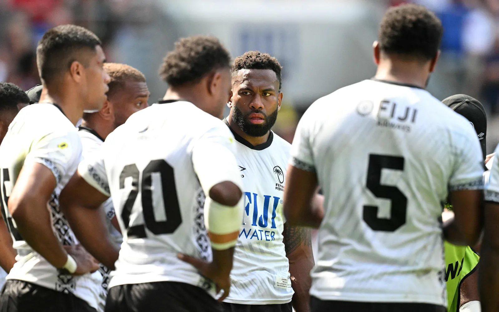 Fiji's flanker Lekima Tagitagivalu (C) and teammates huddle after conceding a sixth try during the Rugby Union Nations Championship match between Fiji and England at Hill Dickinson Stadium in Liverpool on July 11, 2026. (Photo by Oli SCARFF / AFP)