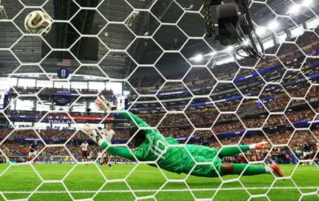 Spain’s Mikel Oyarzabal scores their first goal from the penalty spot.